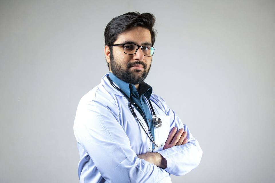 Doctor reviewing resources on device